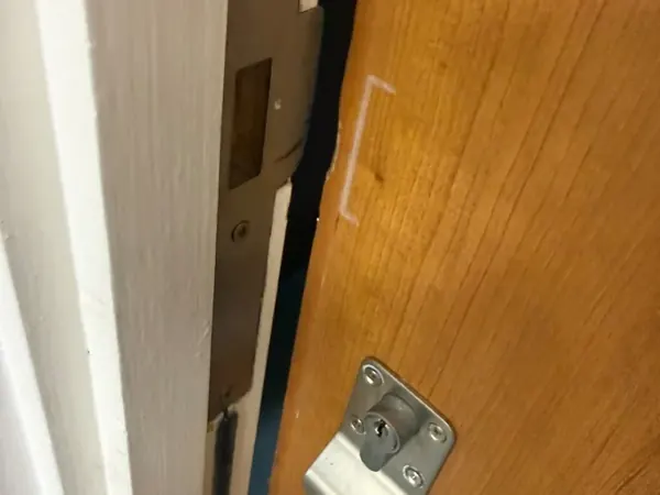 Repaired door frame with mortice keep and timber door