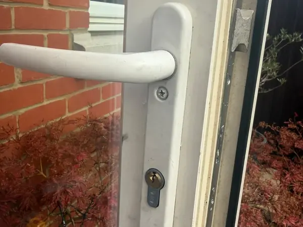 White lever handle and euro cylinder on a uPVC back door